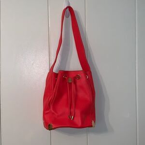 Vince Camuto neon orange drawstring bucket purse